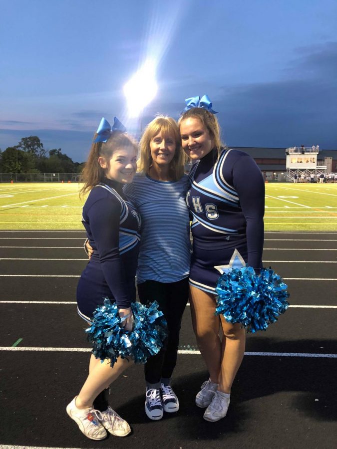 Triton Cheerleaders with their new coach at last year's final football game