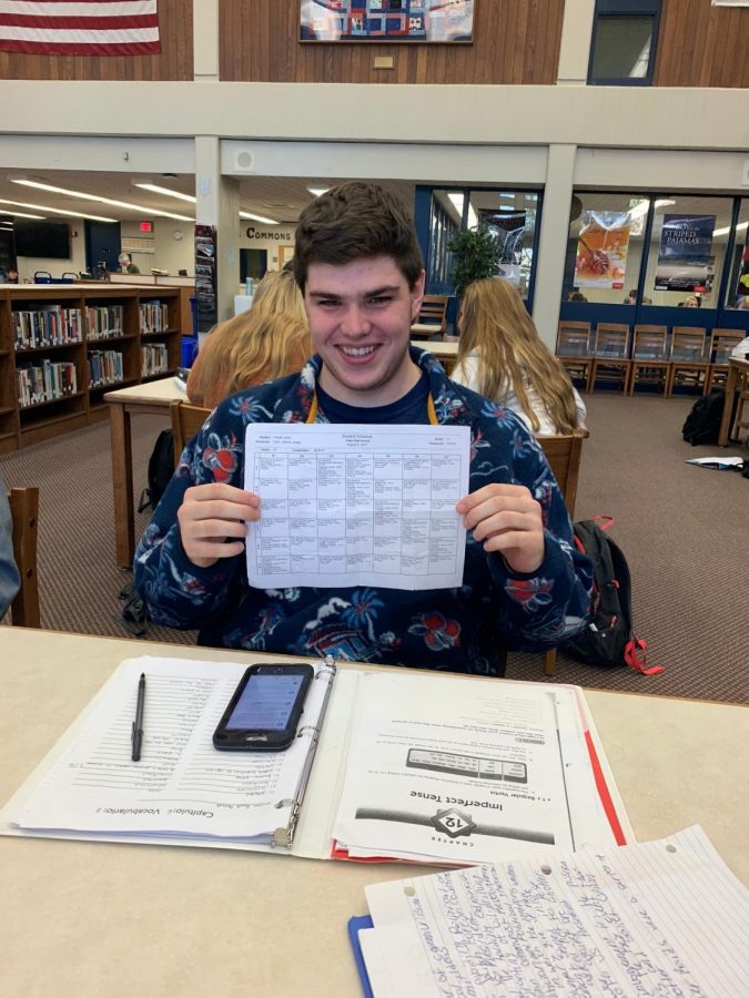 Junior, Jacob Thissell, holding up his schedule. 