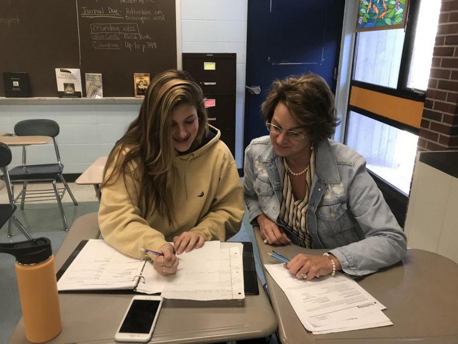  Mrs. Spinale helping Aliyah Frasca with English work.