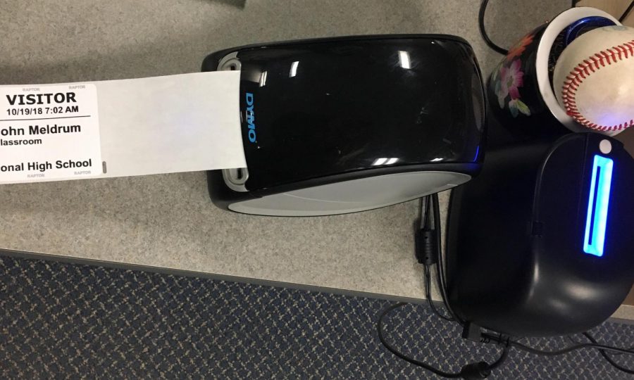 The Raptor ID scanner and badge printer on Kimberly Wright’s desk
