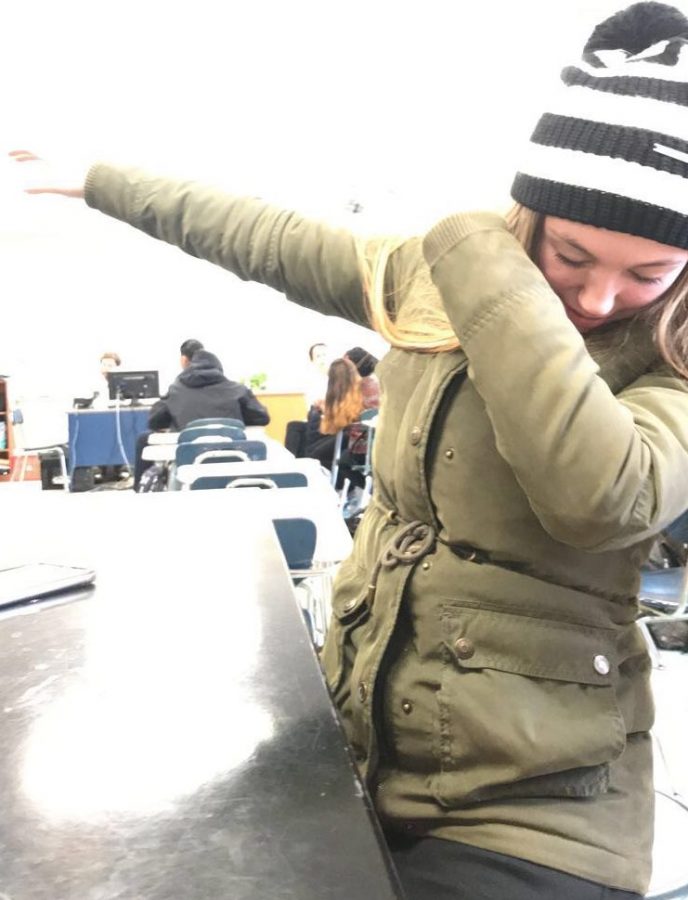 A Triton student dabs, a popular recent trend