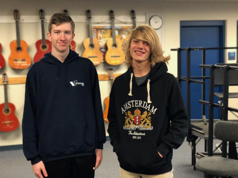 Janvrin (left) and Callewaert (right) standing together in the singer’s room in Triton High School.