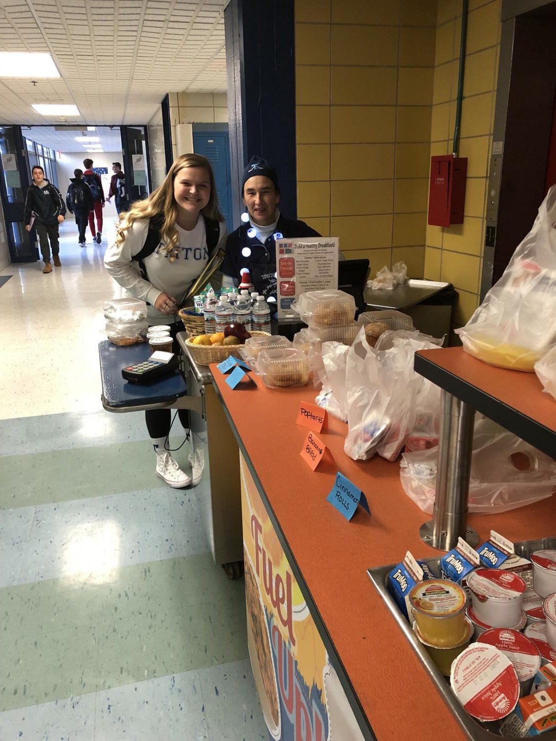 Senior Amy Clark with Cafeteria Worker Andrea Campbell at one of the Second Chance Breakfast carts