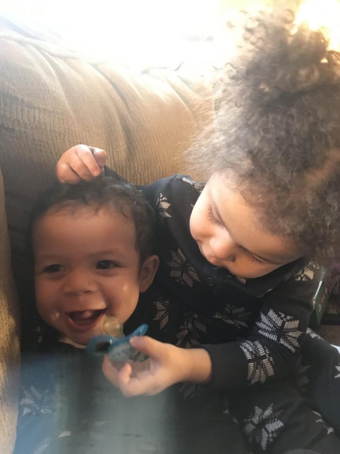 Siblings, Leia Miller, and Jamison Miller whom attend Kindercare play together on a recent school day.