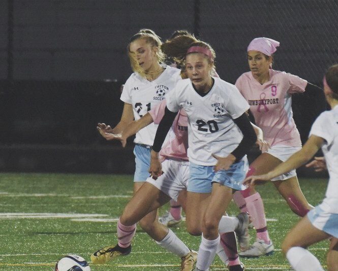 Triton three-sport athlete Emily Colby hustles for the ball during a soccer game this past fall.