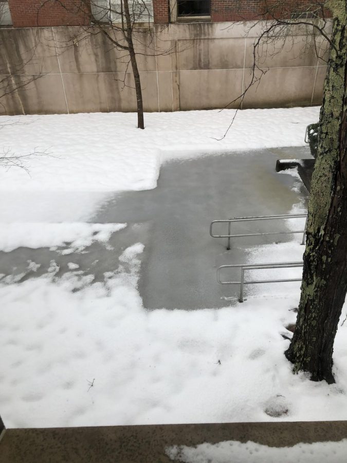 the snow flooded courtyard isnt even snow its inches of dangerous slush covered in a coat of snow