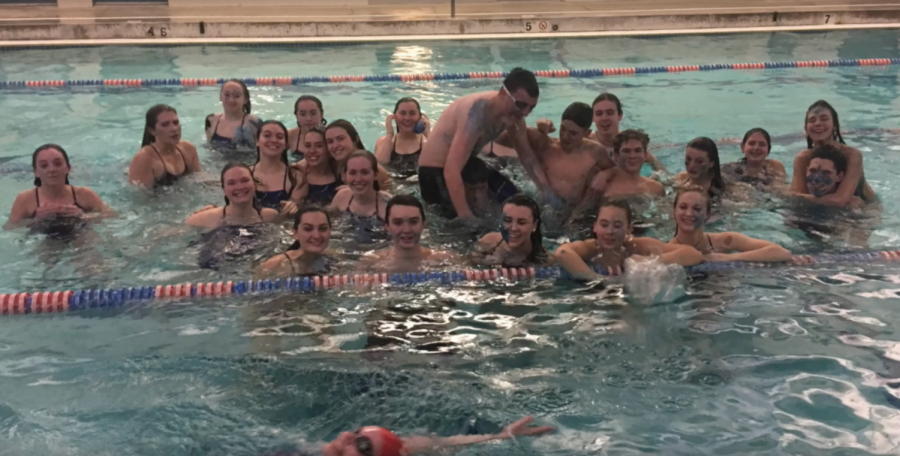 Swimmers from the THS girls and boys swim teams goof around in the pool on a recent practice day.
