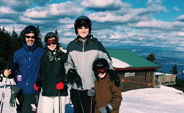 One of the authors, Mackenna Faucher and her family pose on an ideal ski day at Gunstock Mountain