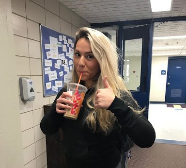 Junior Kaia Cohen takes a sip of her last school-day-coffee.