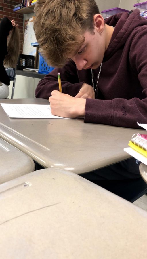 Kiefer Callewaert taking a grammar quiz that was given by his classmate Alex Micals 