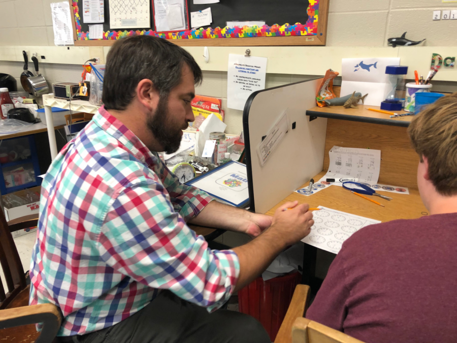 Here is Mr. Swartz helping his student with a worksheet.
