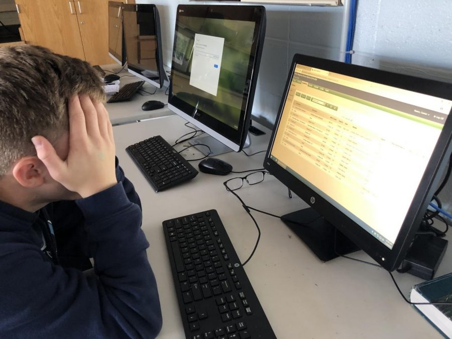 Student Connor Noone checks his grades in Aspen on a recent school day