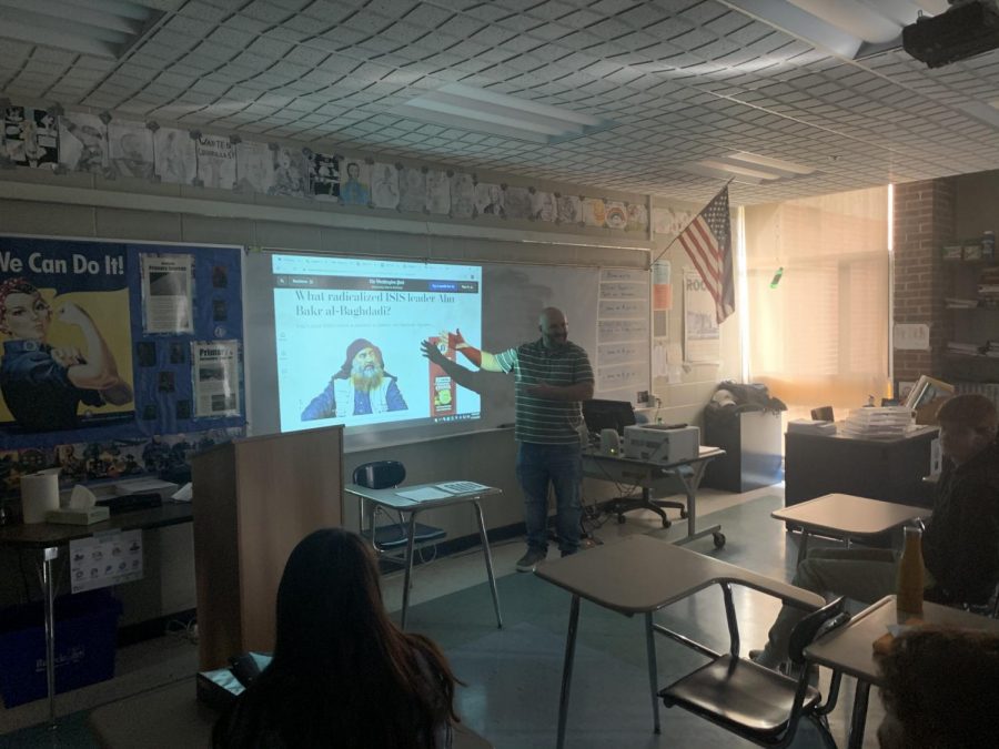 Mr. Chad Richard teaches a lesson his U.S. history class about the death of Al-Baghdadi