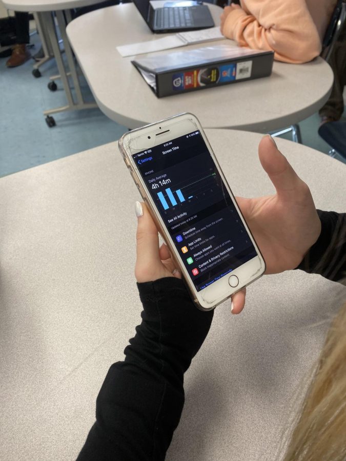 Triton Student Katherine Quigley looks at her screen time used on her phone (Takesian Photo) 