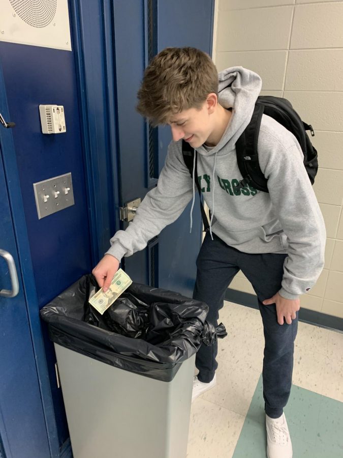Triton student Ethan Mosteller throws away $20 bill saying I hate this bill. he felt empowered by his actions, also stating  I hate Andrew Jackson.
-Stone Butler Photo
