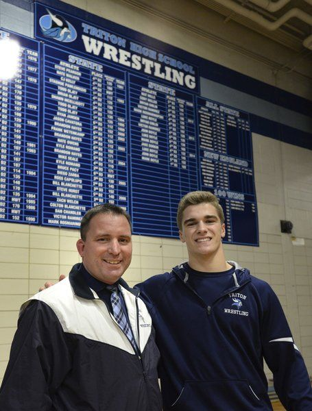 Coach Shawn McElligott with his former star wrestler, John Boyle