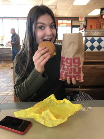 Junior Ana Barona enjoying a cheeseburger from McDonalds, photo taken by Andrew Babine.