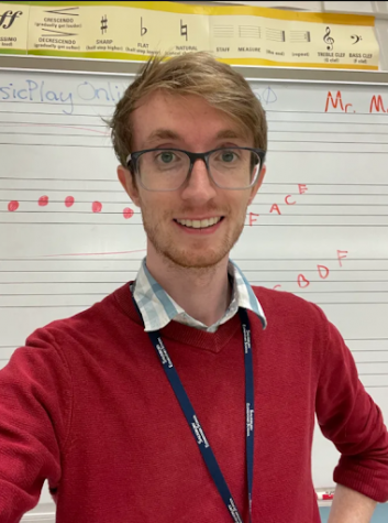 Mr. McConnell in front of his whiteboard, in the Salisbury Elementary music room.