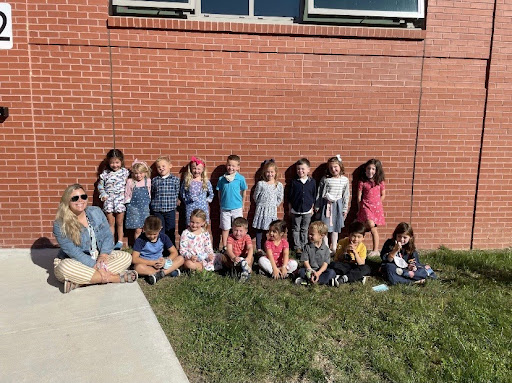 Ms. Fellows and her kindergarten students, in front of Pine Grove School. 