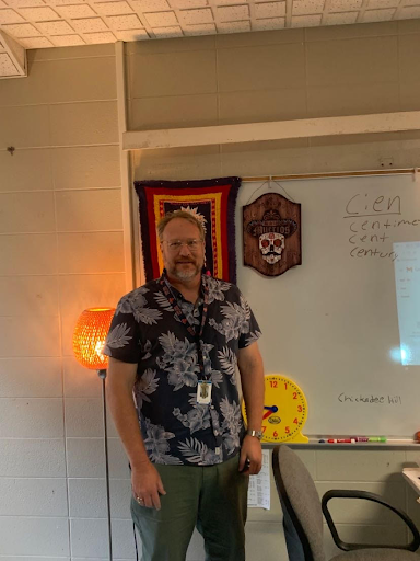 Michael Vanderslice in front of some of his favorite decorations in his classroom.
