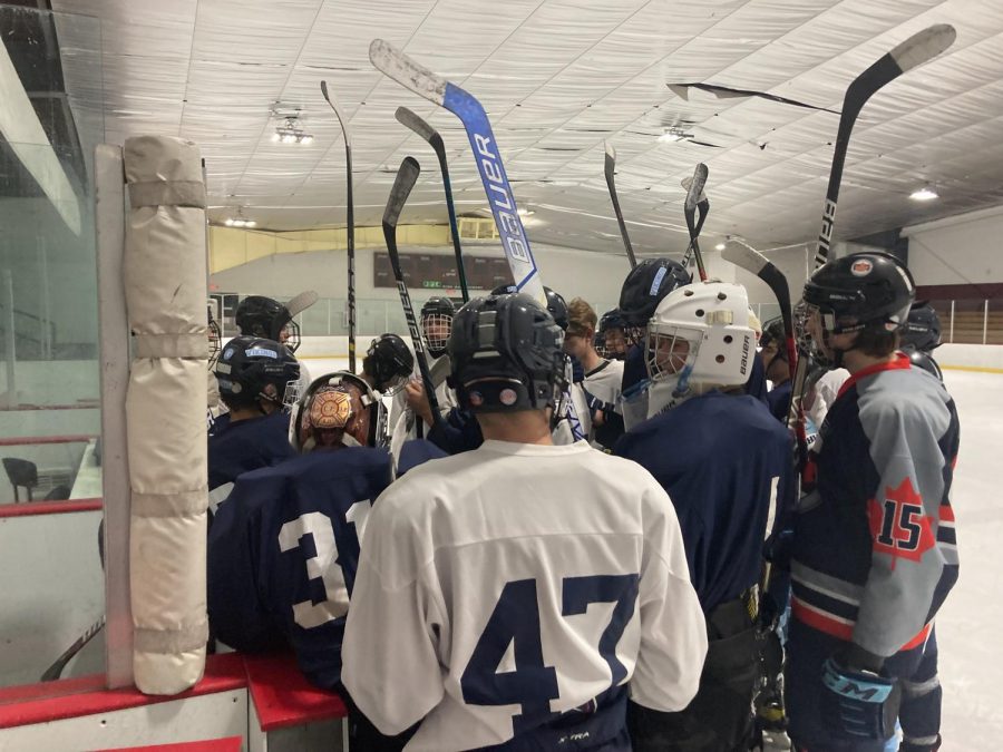 Triton hockey team huddles up after a hard practice