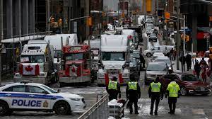 Protesters form a road block in protest of vaccines