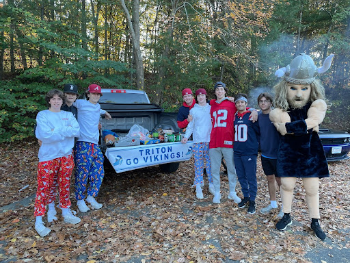 Students pose for a picture at Tritons first ever fan zone tailgate.  
