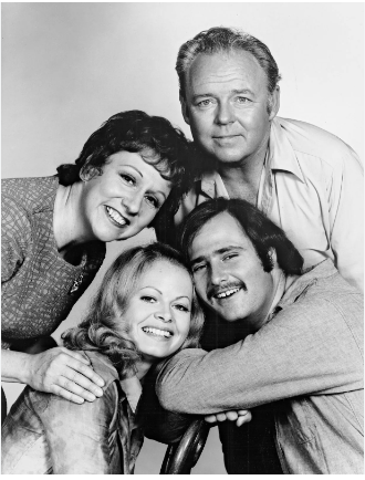 (Clockwise from top right) Carroll OConnor (Archie Bunker), Rob Reiner (Michael Stivic), Sally Struthers (Gloria Stivic, née Bunker), and Jean Stapleton (Edith Bunker), the cast of the television series All in the Family.