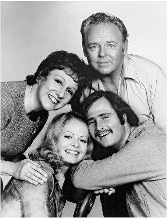 (Clockwise from top right) Carroll O'Connor (Archie Bunker), Rob Reiner (Michael Stivic), Sally Struthers (Gloria Stivic, née Bunker), and Jean Stapleton (Edith Bunker), the cast of the television series All in the Family.