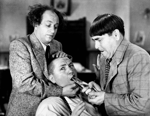 From left to right: Larry Fine, the “middle” stooge, Curly Howard, the dopey meathead, and Moe Howard, the gruff bully (Photo from 1943 short, “I Can Hardly Wait”)
