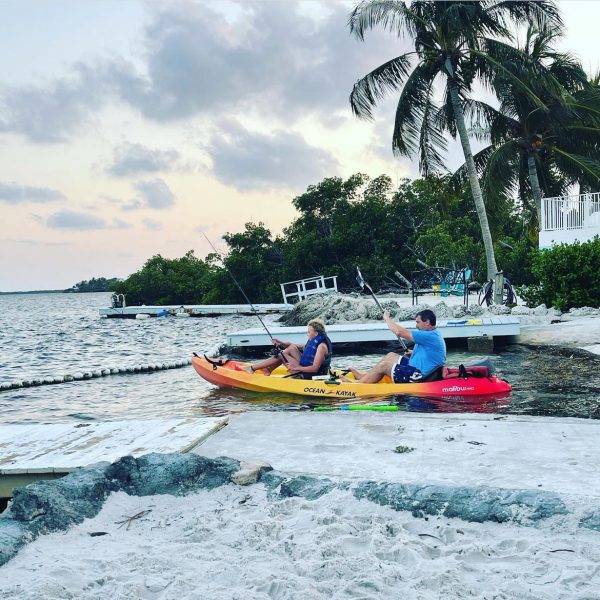 Mr. Jared Ewell and Addison Ewell head out fishing in a kayak during a visit to the Florida Keys, a popular spring break vacation destination.