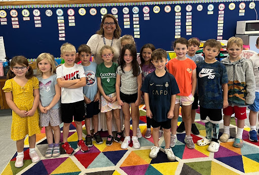 Tracey Marino (in back) taking a visit to her new friends in Mrs. Dolphin's 1st-grade  class.
