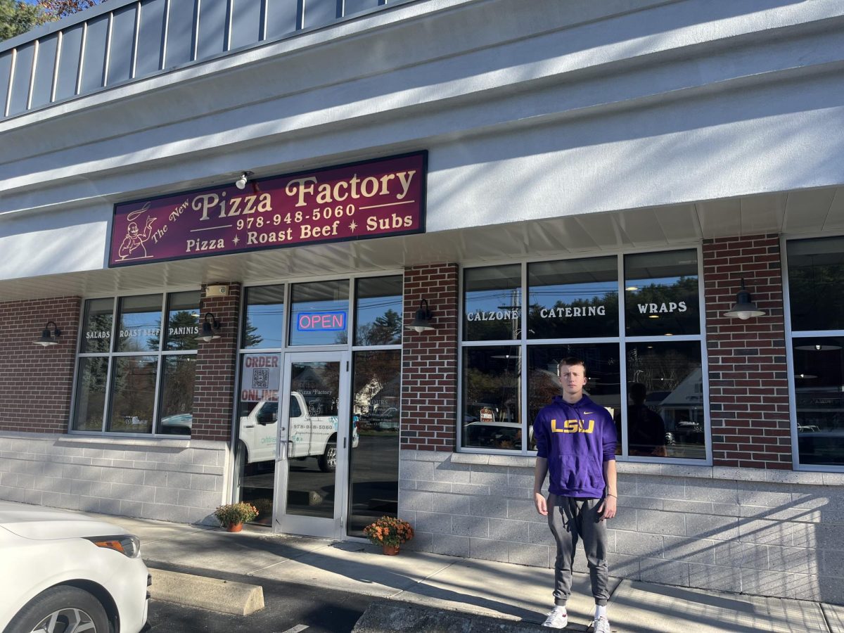 LSU freshman Benjamin P. Shanley standing outside of Rowley Pizza Factory