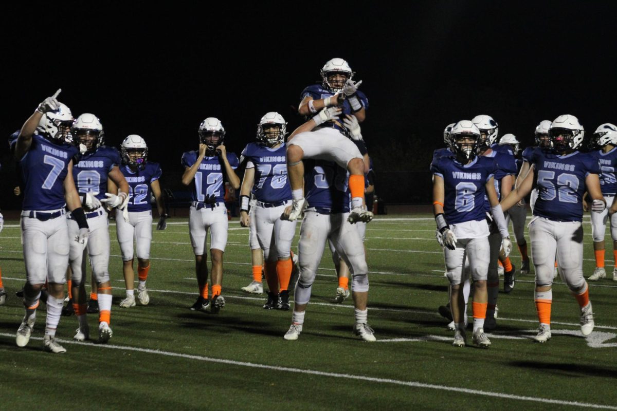 The Triton football team celebrates after a recent win