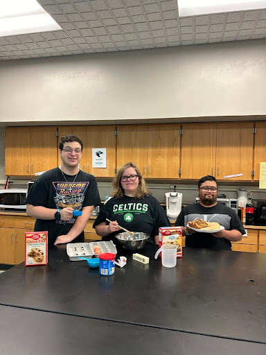 TLC students (left to right) Yanni, Jessica, and Pedro practicing their baking skills. 