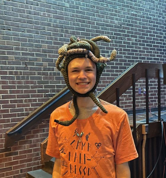 Junior Alex Burnes with his Medusa headpiece and Camp Half-Blood T-Shirt after the first play.

