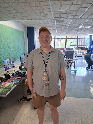 Coach Langlois standing in the entrance to the Triton High School Esports room.
